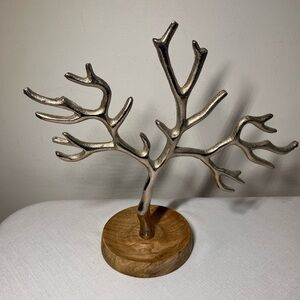 silver-toned metal tree jewelry stand, round wooden base for rings / small items